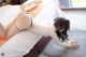 A woman laying on top of a bed in a bedroom.